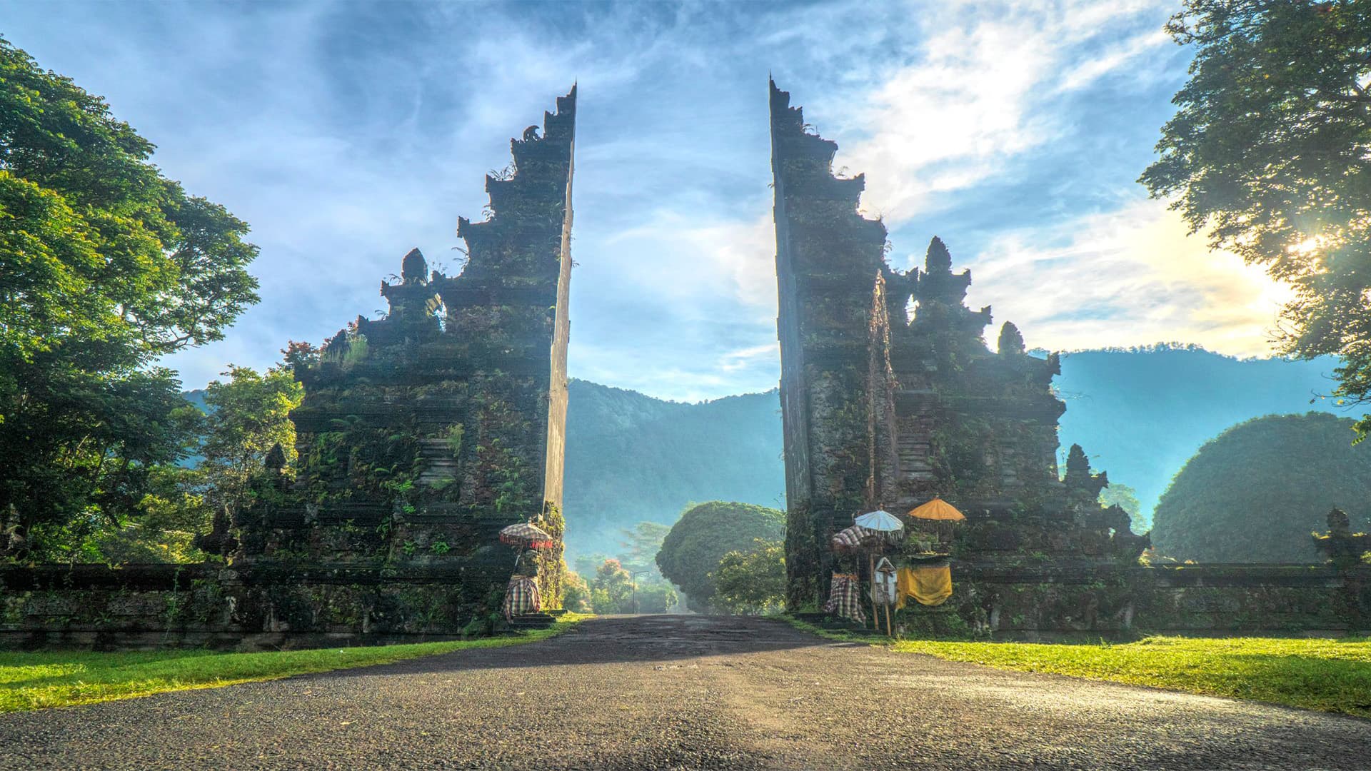 Handara split gateway temple entrance with a misty forested valley beyond, Bali