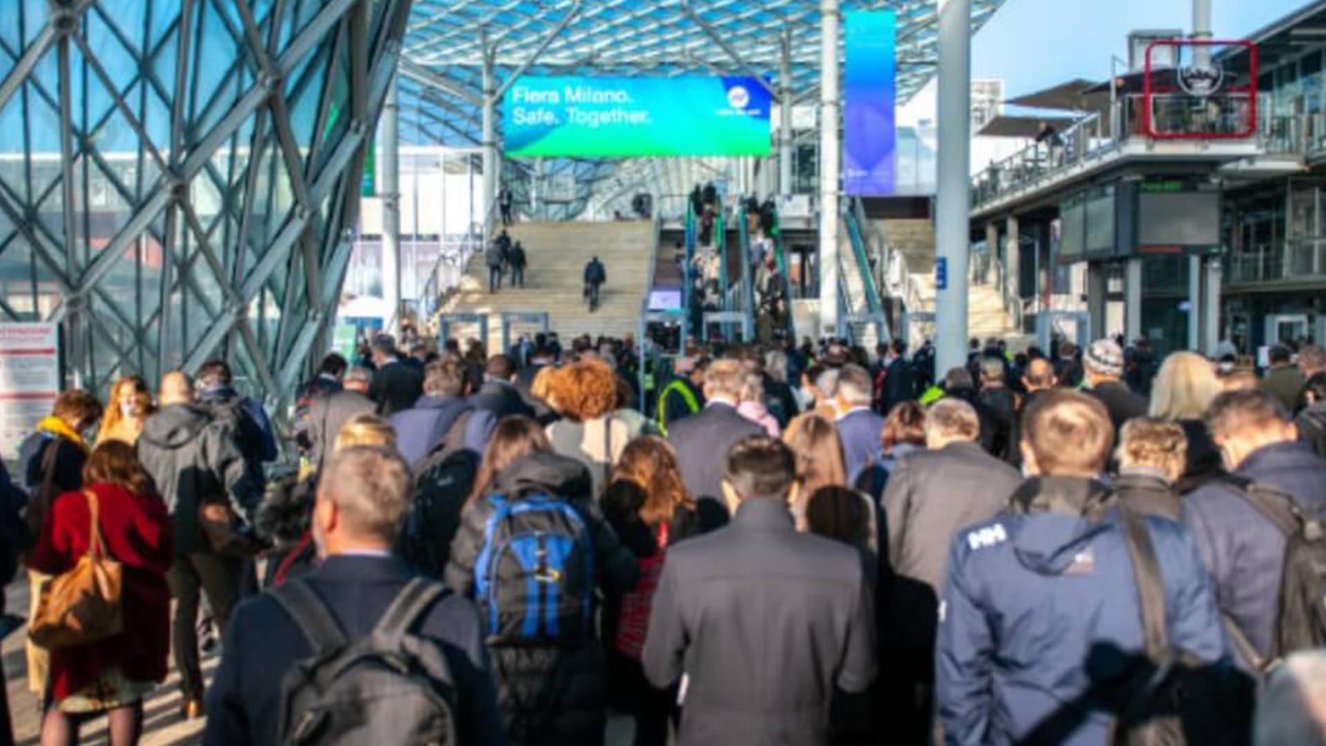 Crowd of delegates entering Fiera Milano under its glass canopy for CPHI Worldwide, Milan